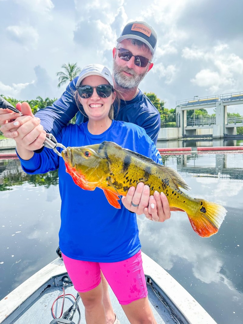 a person holding a fish
