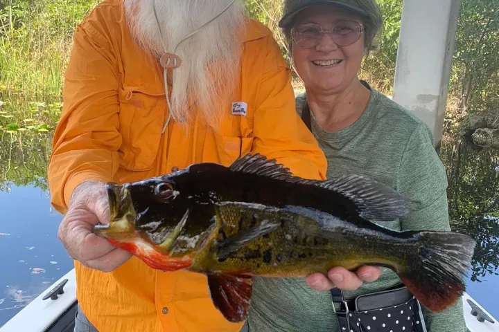 a man holding a fish