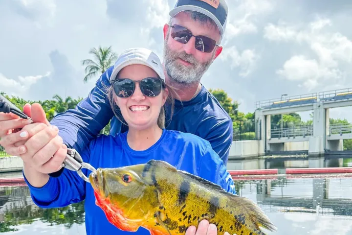 a person holding a fish