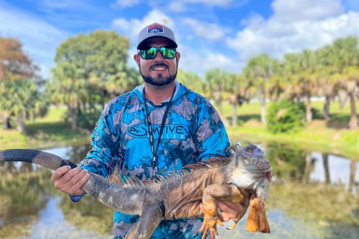 a man riding a horse in a body of water