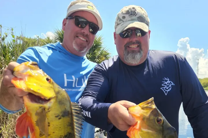 a person holding a fish