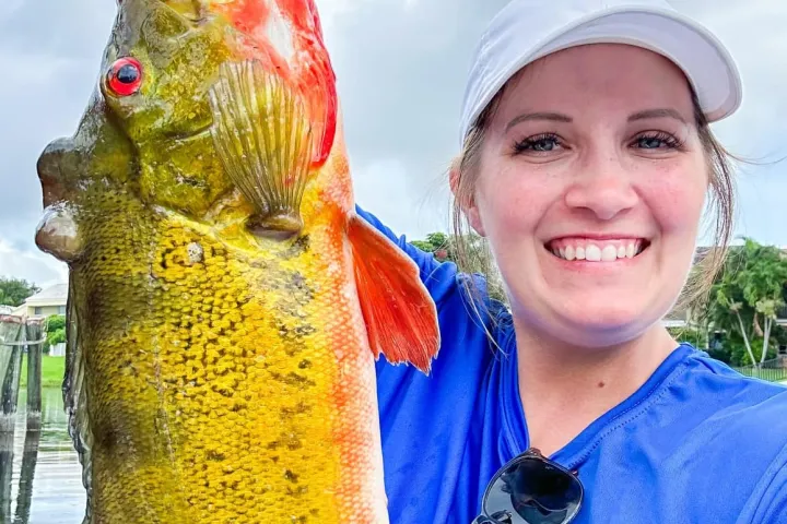 a person holding a fish