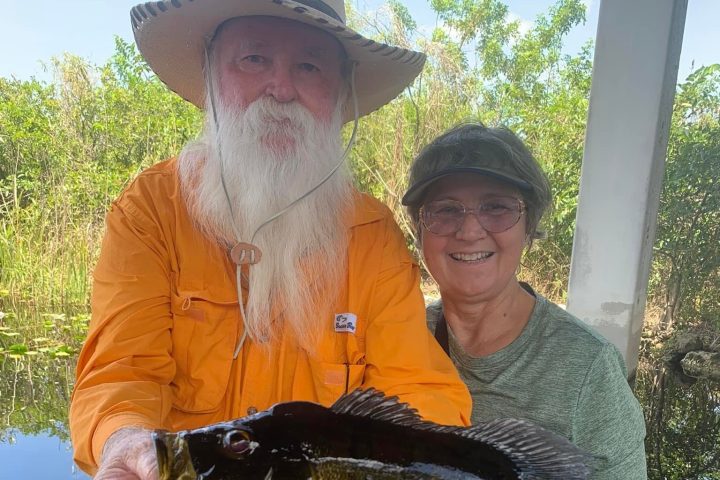 a man holding a fish