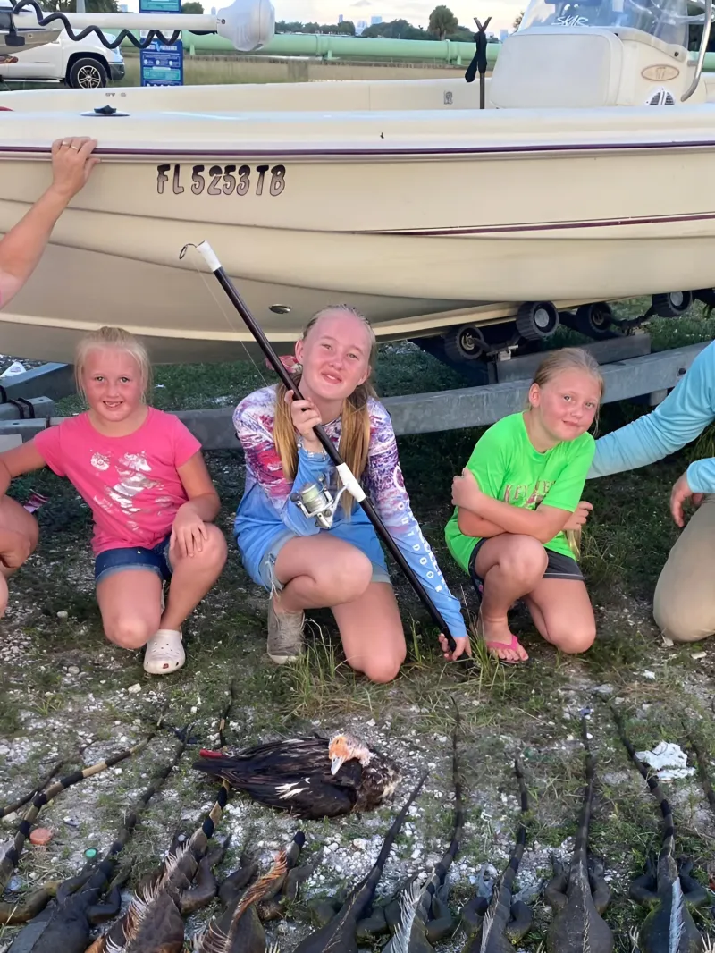a group of people on a boat in the water