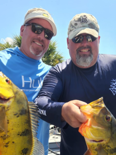 a man holding a fish