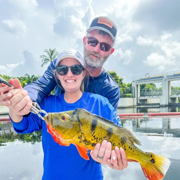 a person holding a fish
