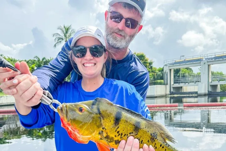 a person holding a fish
