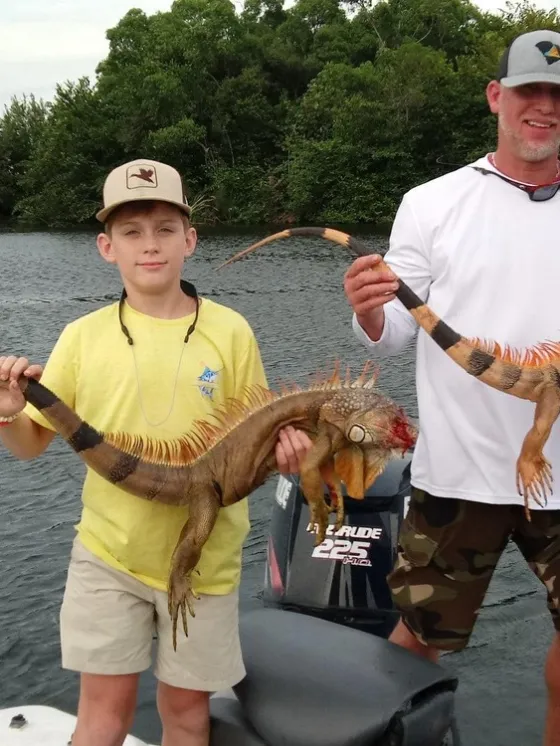 a man holding a fish