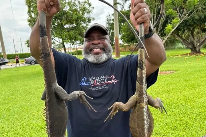 a man holding a fish