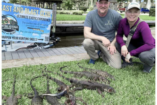 a man that is standing in the grass