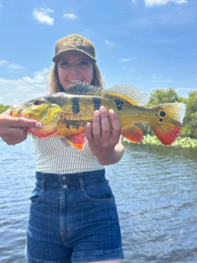 a person holding a fish