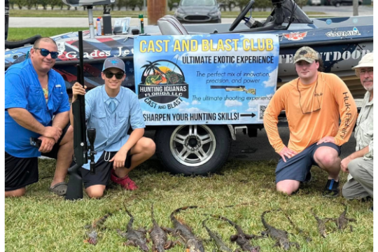a group of people sitting in the grass